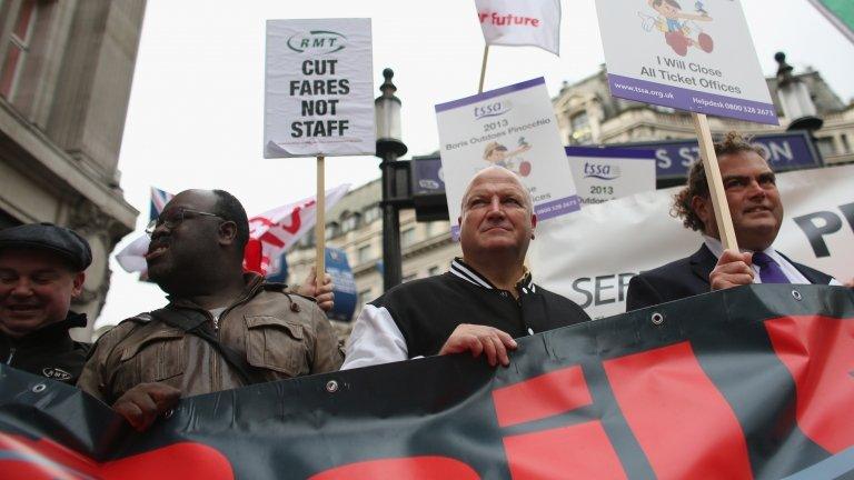 General Secretary Bob Crow (C) and TSSA General Secretary Manuel Cortes (R) join campaign groups protesting outside Oxford Circus tube station against plans to reduce staff on transport routes across the Capital on October 23