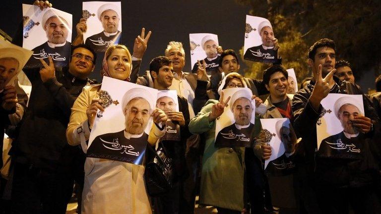 Iranians flashing the sign for victory as the Iranian delegation arrived at Tehran's Mehrabad Airport after signing the agreement in Geneva.