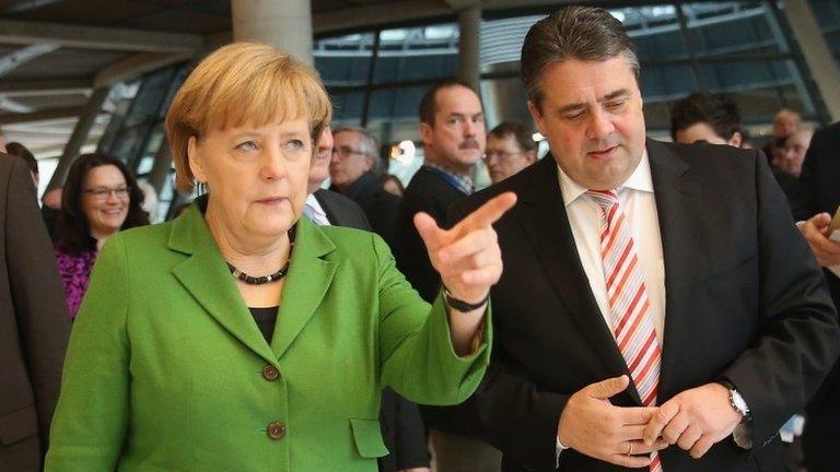 German Chancellor Angela Merkel (L) and Social Democratic Party (SPD) leader Sigmar Gabriel in Berlin, 27 November