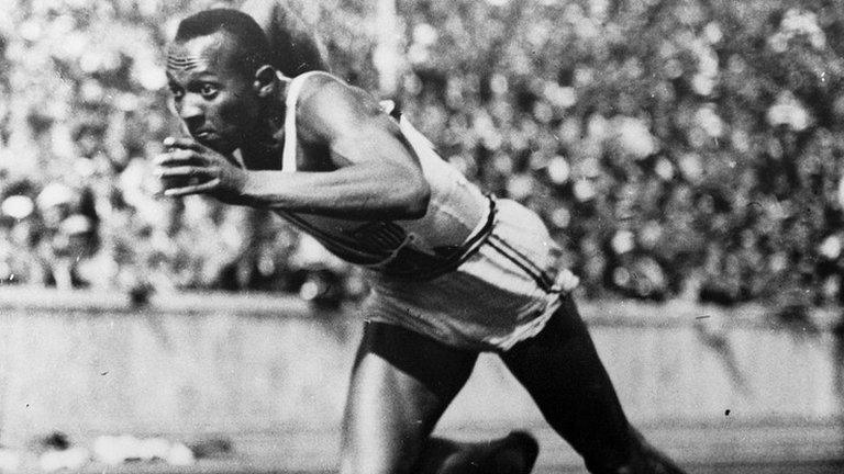 Jesse Owens leaps from the starting line of the 100 Metres dash during the 1936 Olympic Games