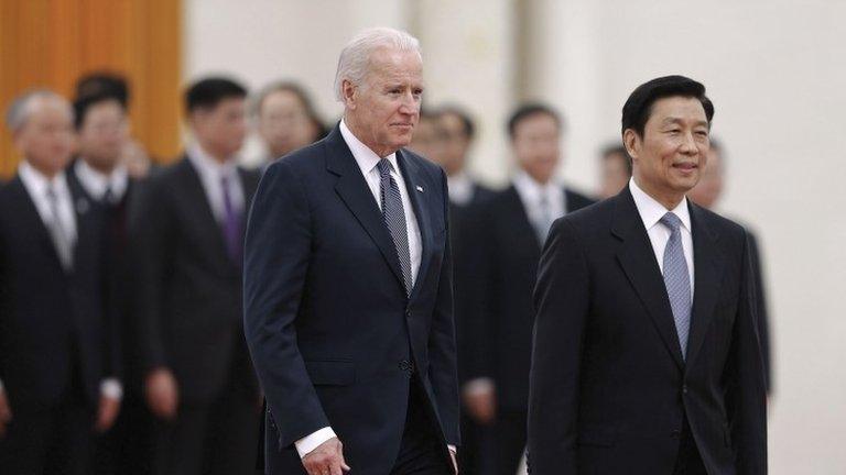 Chinese Vice President Li Yuanchao (2nd L) accompanies U.S. Vice President Joe Biden