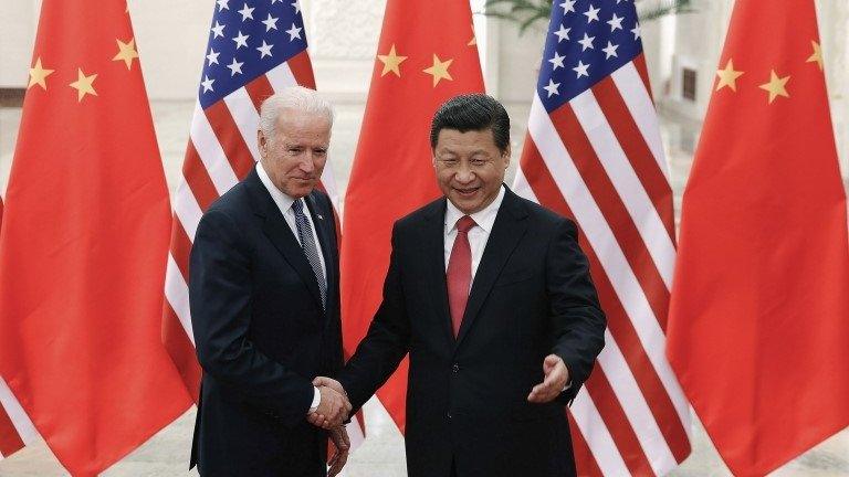 Chinese President Xi Jinping (right) shakes hands with US Vice-President Joe Biden (left) inside the Great Hall of the People in Beijing 4 December 2013