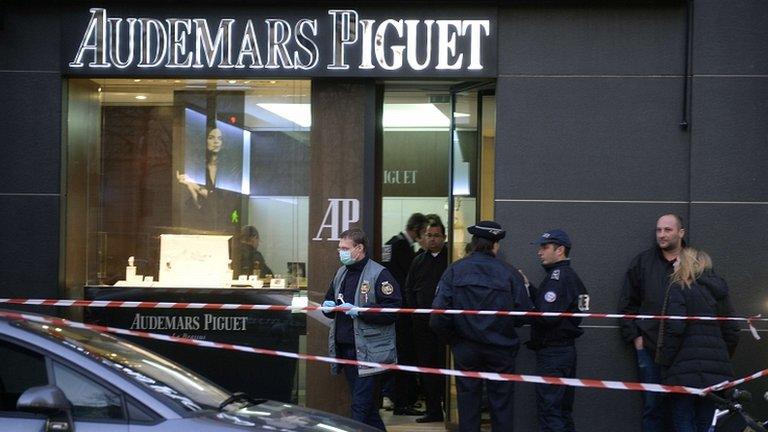 Forensic policemen are seen working in a jewellery store that was attacked in Paris