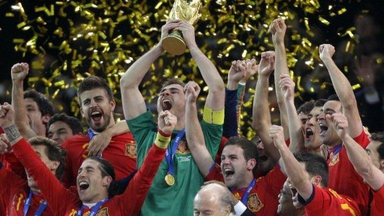 Spain team members celebrate with the World Cup trophy after the World Cup final soccer match between the Netherlands