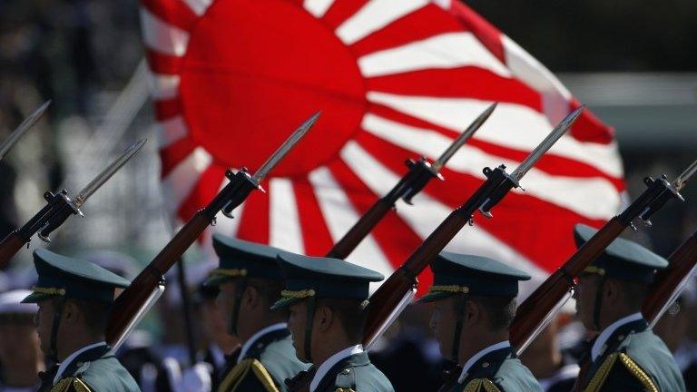 Japanese soldiers march during the annual SDF troop review ceremony at Asaka Base near Tokyo October 27, 2013