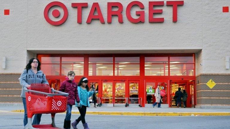 Shoppers leave a retail Target on Thursday in Hackensack, New Jersey, 19 December 2013