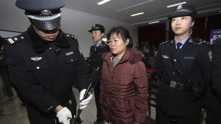 Zhang Shuxia stands trial in Weinan Intermediate People's Court in Weinan, Shaanxi province, 30 December 2013