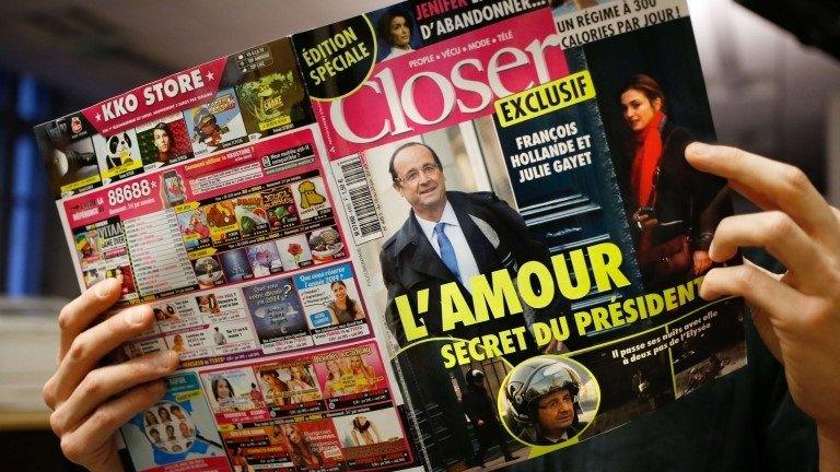 A man reads Closer magazine in Paris, 10 January