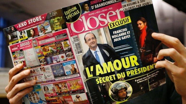 A man reads French magazine Closer, on January 10, 2014 in Paris