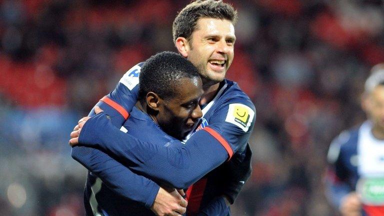 Paris Saint-Germain's Thiago Motta celebrates with French midfielder Blaise Matuidi