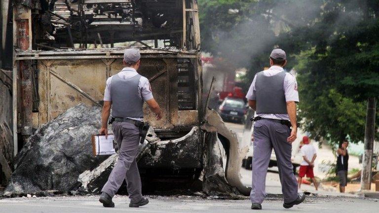 Policemen outside Vida Nova bus station in Campinas