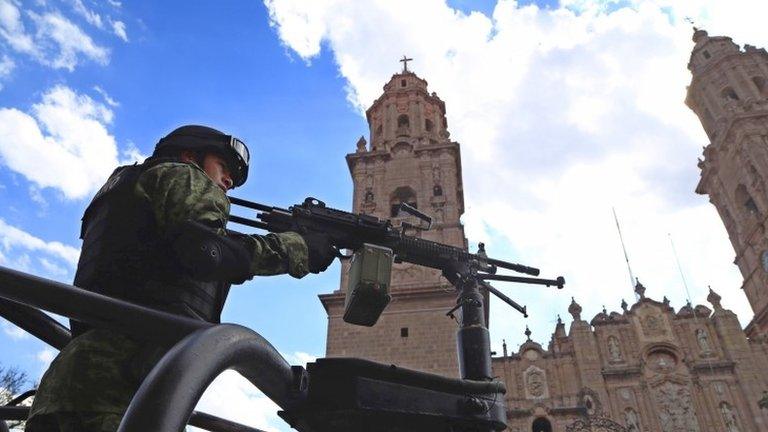 Mexican soldier patrols Morelia