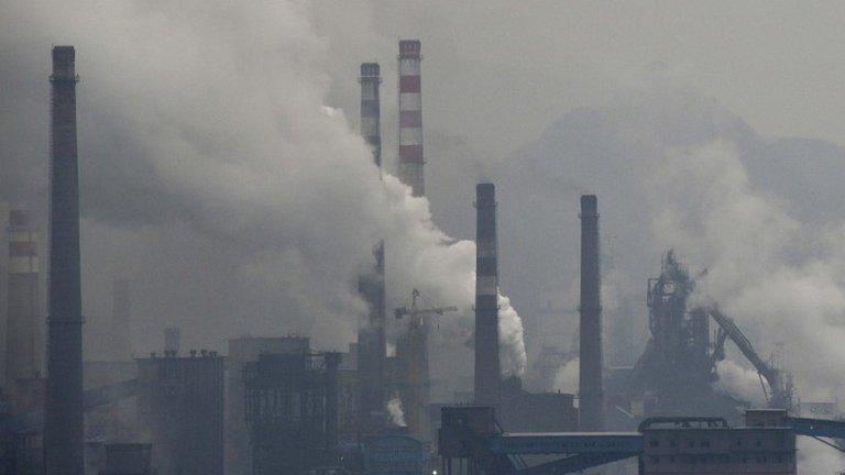 Smoke rises from chimneys and facilities of steel plants in Benxi, China. Photo: November 2013