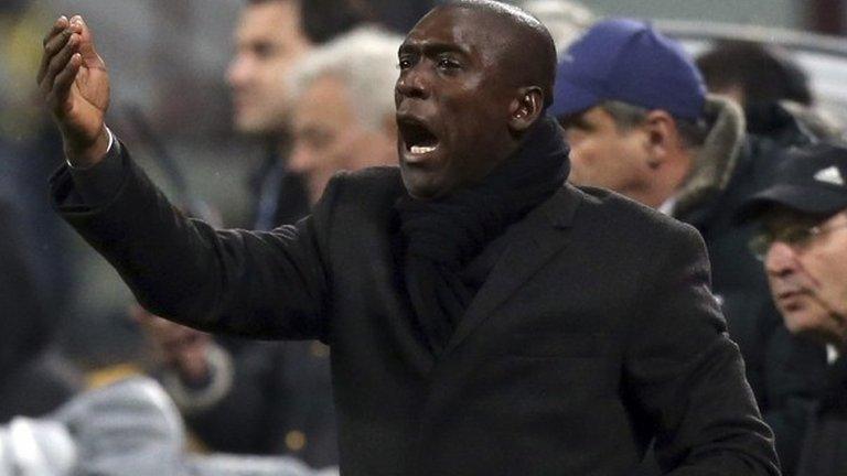 New AC Milan coach Clarence Seedorf gestures during the team's Serie A match against Hellas Verona