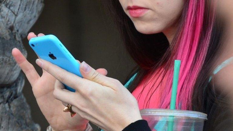 Woman uses a phone (file image)