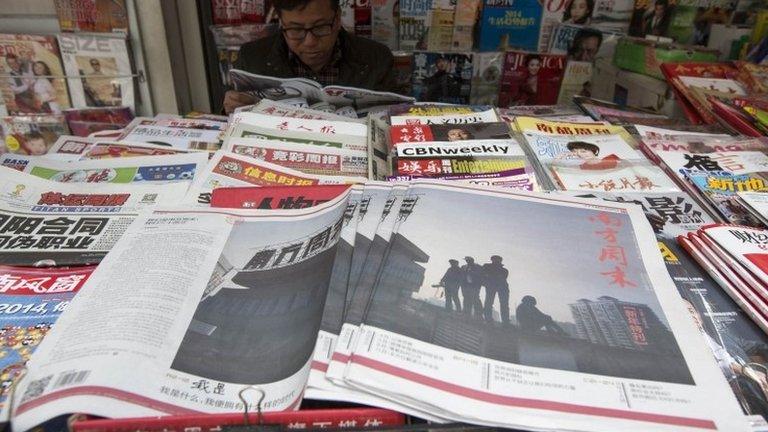 Southern Weekly newspaper copies are left on display at a newsstand in the southern Chinese city of Guangzhou, 7 January 2014.