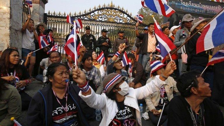 Anti-government protesters sit outside a polling station in central Bangkok January 26, 2014