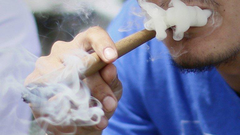 Man soking cannabis in Denver, 20 April 2013