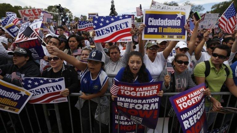 Hundreds of protesters calling for comprehensive immigration reform gather at a rally on the Washington Mall 8 October 2013