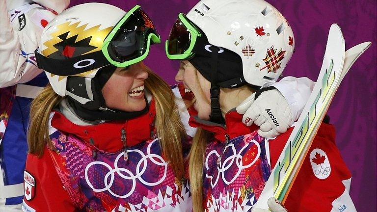 Chloe Dufour-Lapointe (L) of Canada congratulates her sister, winner Justine Dufour-Lapointe