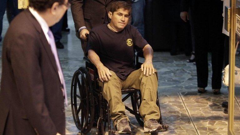 Jose Salvador Alvarenga arrives in a wheelchair to El Salvador airport