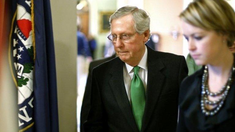 US Senate Minority Leader Mitch McConnell returns to his office after a vote to raise the debt ceiling at the US Capitol in Washington 12 February 2014