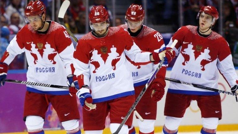 Team Russia skates back on the ice after a break in the third period of a men's quarter-final ice hockey game against Finland