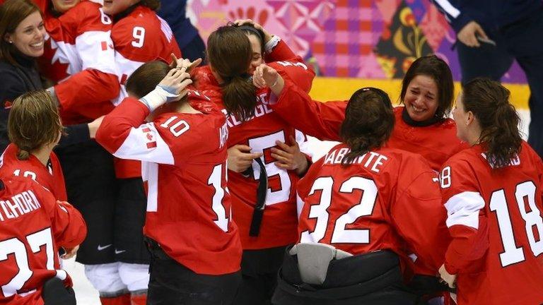 Canada celebrates after Marie-Philip Poulin #29 scored the game-winning goal