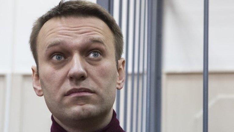 Russian opposition activist and anti-corruption crusader Alexei Navalny listens in the court room in Moscow