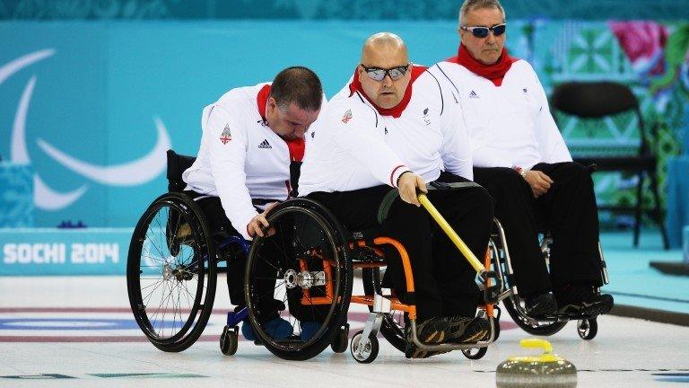 Britain's Gregor Ewan delivers a stone against Canada