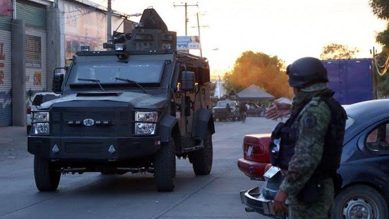 Police guard the morgue where Nazario Moreno's body is held, Apatzingan, Michoacan state, Mexico (10 March 2014)