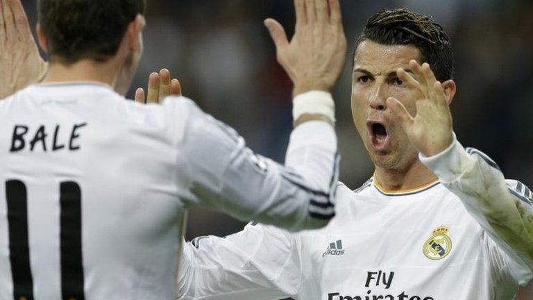 Real's Cristiano Ronaldo, right, celebrates with Gareth Bale