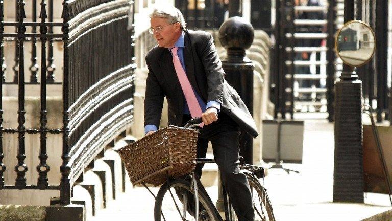 Andrew Mitchell on a bicycle