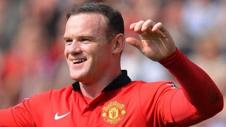 Manchester United striker Wayne Rooney celebrates after putting his side ahead from the penalty spot