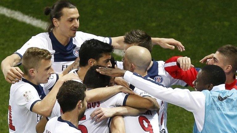 Paris Saint-Germain's Swedish forward Zlatan Ibrahimovic (second left) joins team-mates