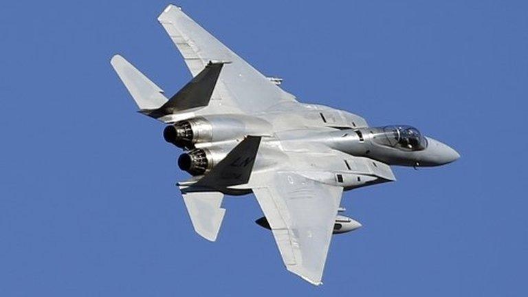 A USAF F-15 jet fighter flies over Siauliai airbase during the Lithuania-Nato exercise at the Siauliai airbase