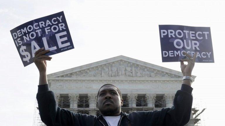 Cornell Woolridge of Windsor Mill, Maryland takes part in a demonstration outside the Supreme Court in Washington as the court heard arguments on campaign finance 8 October 2013