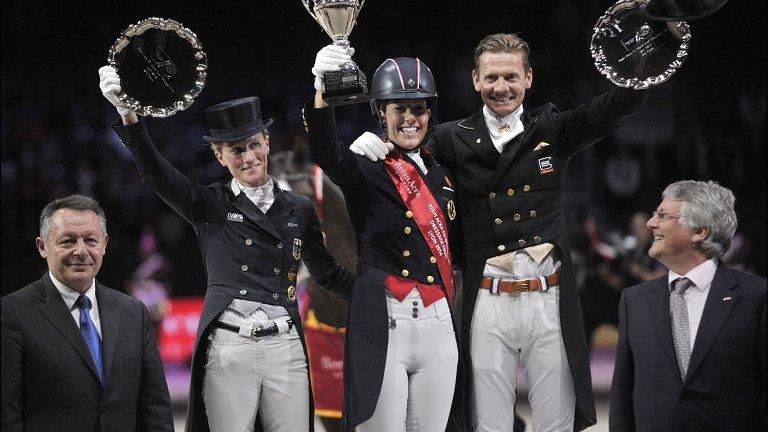 Germany's Helen Langehanenberg, Britain's Charlotte Dujardin (C), and Netherland's Edward Gal