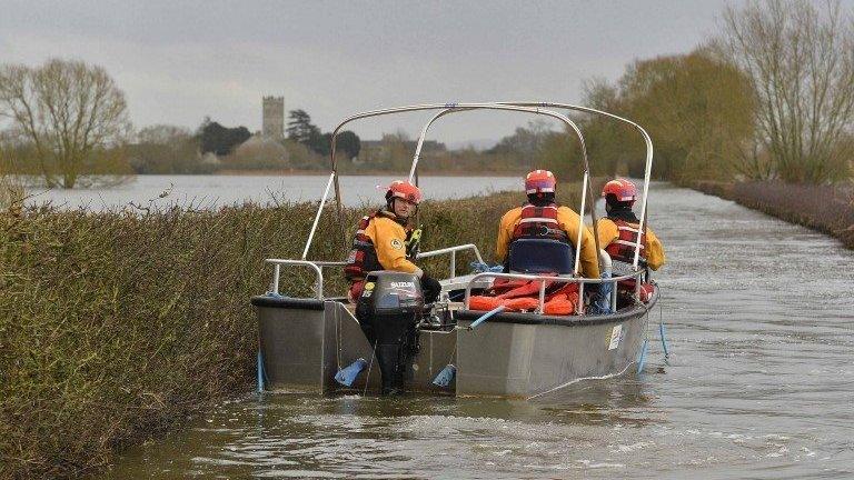 Boat operated by emergency services heading toward Muchelney