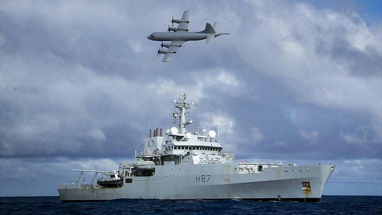 An RAAF AP-3C Orion aircraft flies past British naval ship HMS Echo in the Indian Ocean as they continue to search for missing Malaysia Airlines flight MH370 - 15 April 2014