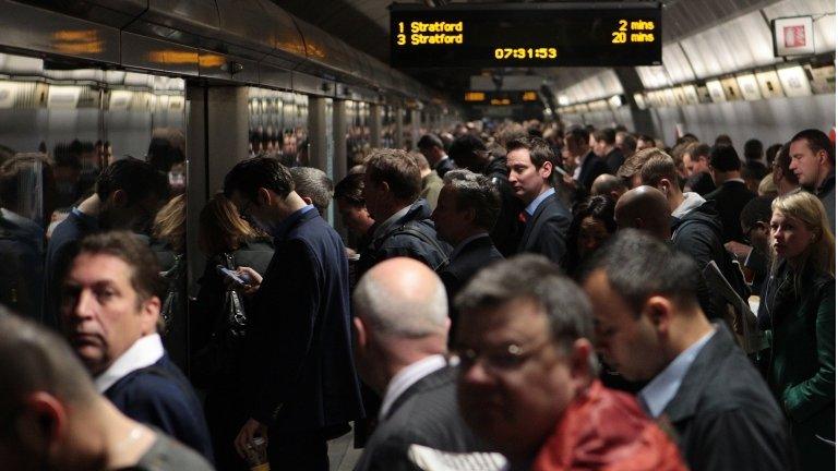 Commuters wait for the Jubilee line at Waterloo underground station