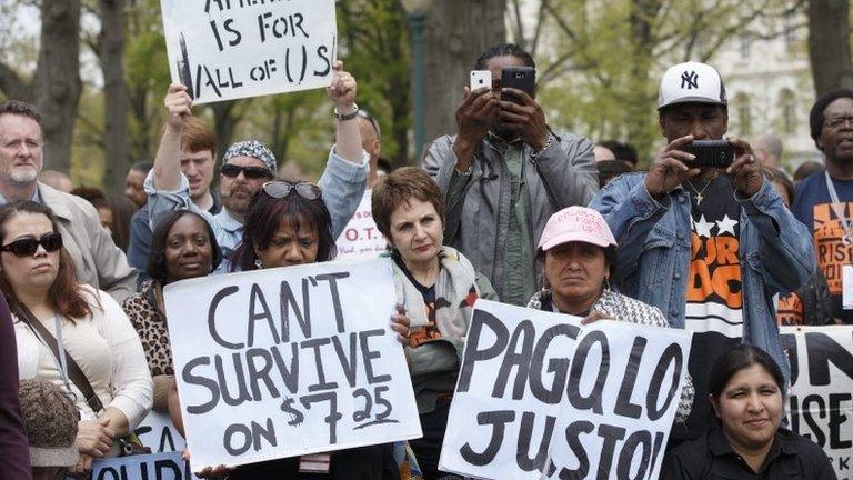 Demonstrators demand a rise in the minimum wage on 28 April in Washington