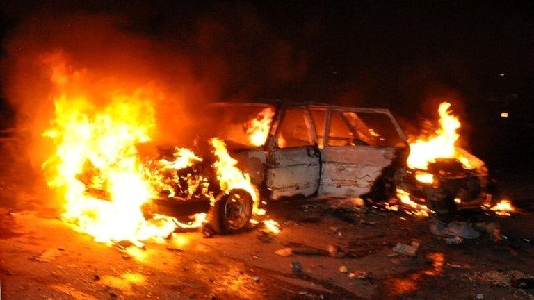 A vehicle burns at the site of an explosion in Abuja, Nigeria - 1 May 2014