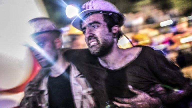 An injured miner on 13 May 2014