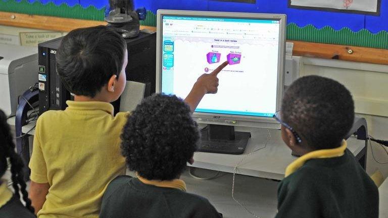 Primary school pupils using a computer