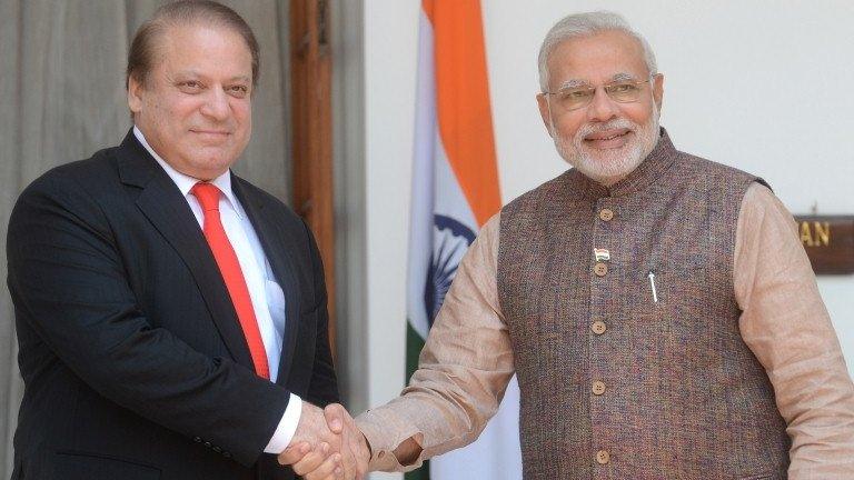 India"s newly sworn-in Prime Minister Narendra Modi (R) shakes hands with Pakistani Prime Minister Nawaz Sharif during a meeting in New Delhi on May 27, 2014.