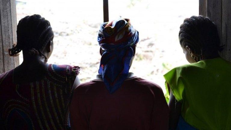 Three women at a camp for displaced people in eastern Democratic Republic of Congo. One of them was raped (22 August 2013)