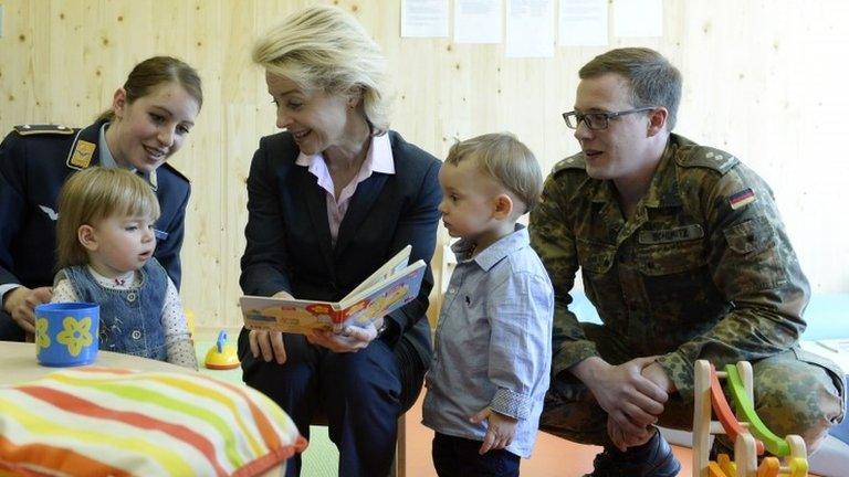 German Defence Minister Ursula von der Leyen meets children at the opening of an army nursery in Munich, 12 May