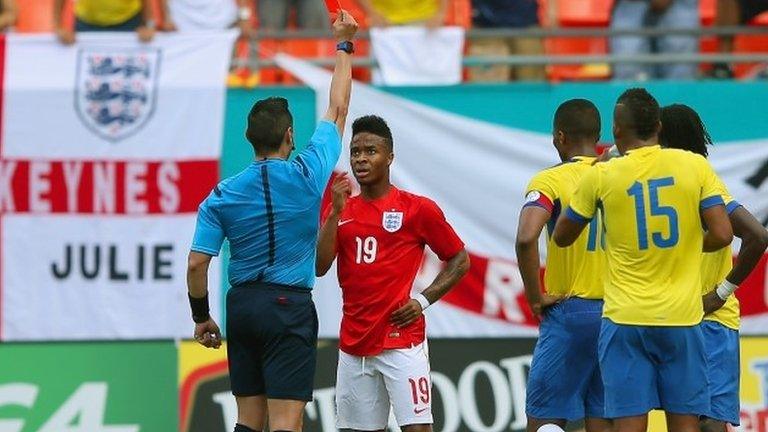 Referee Jair Marrufo shows Raheem Sterling of England a red card