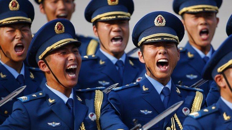 Soldiers from the honour guards of the Chinese Army shout as they march during a welcoming ceremony for Kuwait's Prime Minister in Beijing, June 3